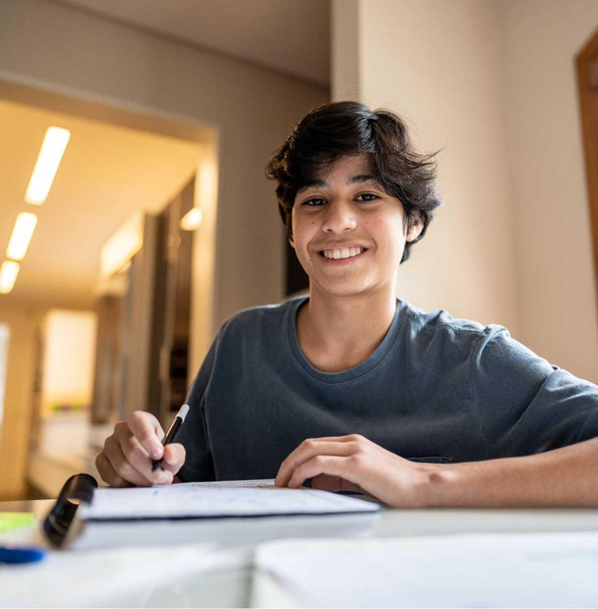 Happy student doing homework