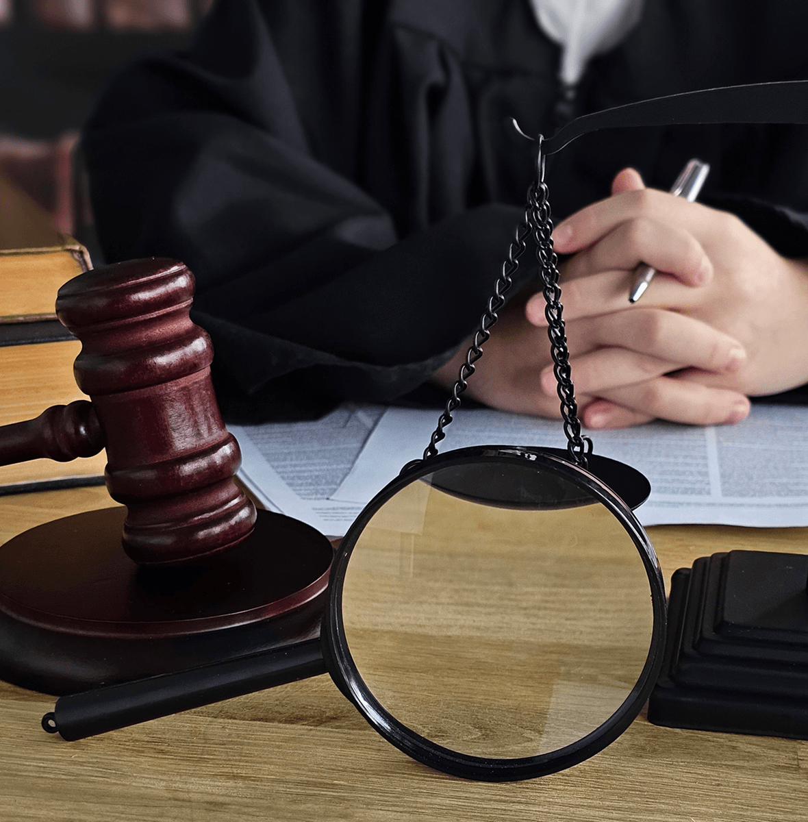 Legal documents, gavel, and scales in courtroom