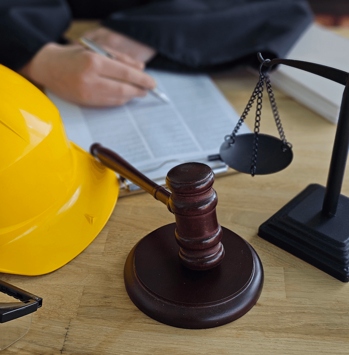 Gavel and hard hat on desk