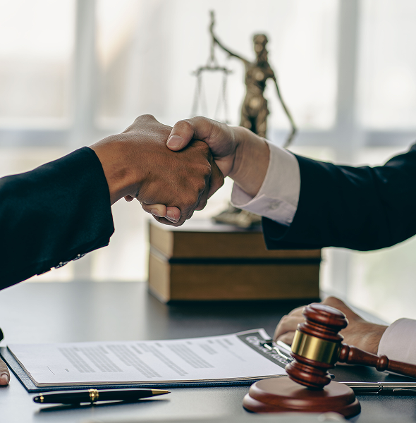 Agreement reached with handshake and gavel